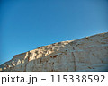 Breathtaking White Cliff Against Clear Blue Sky 115338592