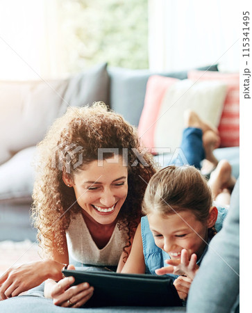 Family, mother and child with tablet in watching on weekend, break at home for e learning or gaming. Happy people, lounge and relax in together for bonding as parents for growth, development and love Family, mother and child with tablet in watching on weekend, break at home for e learning or gaming. Happy people, lounge and relax in together for bonding as parents for growth, development and love 115341495
