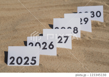 Paper cards with numbers of years from 2024 to 2030 in a row. New year start concept. Resolution time is flying plan goal motivation 115345130