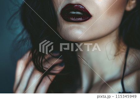 A woman with long dark hair and red lipstick A woman with long dark hair and red lipstick 115345949