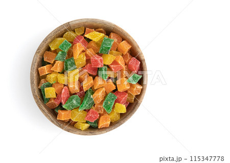 candied fruit in wooden bowl isolated on white 115347778