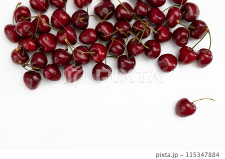 pile of cherries isolated on white background, top view 115347884