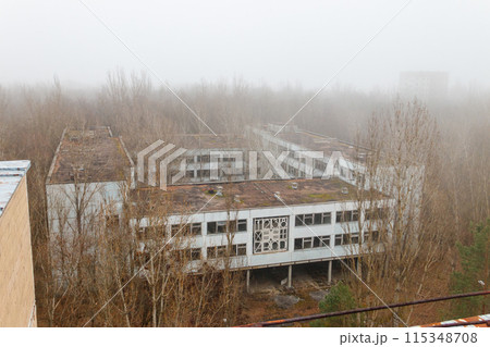View of ghost town Pripyat at autumn in Chernobyl Exclusion Zone, Ukraine. View from above View of ghost town Pripyat at autumn in Chernobyl Exclusion Zone, Ukraine. View from above 115348708