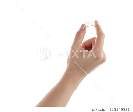Female hand hold transparent pill isolated on white Female hand hold transparent pill isolated on white 115349581