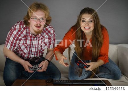 Gaming couple playing games Gaming couple playing games 115349658