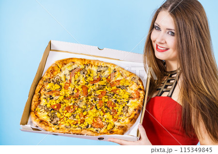 Woman holding big pizza in box Woman holding big pizza in box 115349845