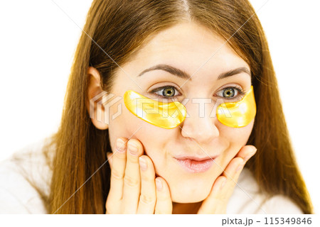Woman with gold patches under eyes Woman with gold patches under eyes 115349846