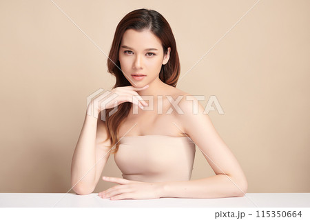 Beautiful young asian woman with clean fresh skin on beige background, Face care, Facial treatment, Cosmetology, beauty and spa, Asian women portrait. 115350664