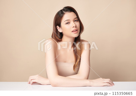 Beautiful young asian woman with clean fresh skin on beige background, Face care, Facial treatment, Cosmetology, beauty and spa, Asian women portrait. 115350665