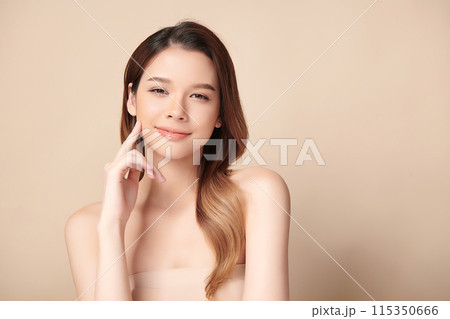 Beautiful young asian woman with clean fresh skin on beige background, Face care, Facial treatment, Cosmetology, beauty and spa, Asian women portrait. Beautiful young asian woman with clean fresh skin on beige background, Face care, Facial treatment, Cosmetology, beauty and spa, Asian women portrait. 115350666
