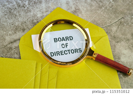 The words BOARD OF DIRECTORS is written on paper sticking out of a mustard-colored envelope 115351012