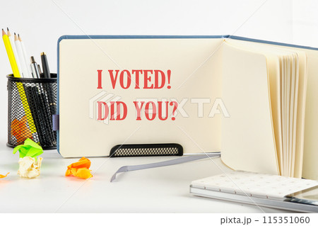 Concept words I voted. I voted. Did you symbol. on a blank sheet of an open business notebook 115351060