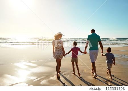 Happy family, walking and holding hands at beach in summer for relax, travel and holiday in Miami. Children, parents and people at ocean with back for vacation, trust and bonding together by water 115351308