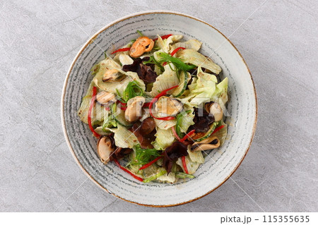 Salad with mussel, iceberg lettuce, dressed with top selling nut sauce for restaurant and café 115355635