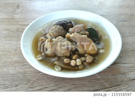 boiled pork knuckle with peanut and ginger with mushroom soup on plate boiled pork knuckle with peanut and ginger with mushroom soup on plate 115358597