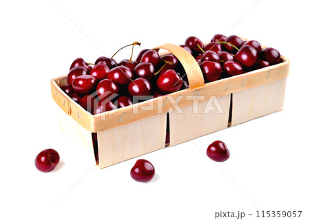 Ripe natural cherries, sweet cherries in a birch bark basket on a white background 115359057