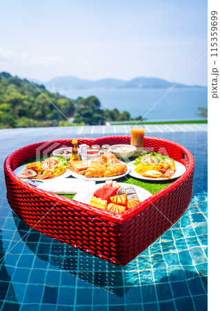 Floating brekfast in a heart shape in Patong, in Phuket, Thailand Floating brekfast in a heart shape in Patong, in Phuket, Thailand 115359699