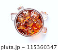 Topview cola with ice in glass on white background with ice on ground 115360347