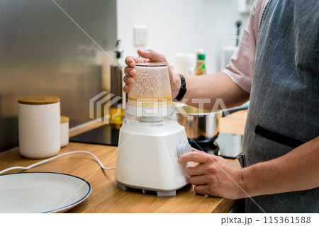 Chef at the kitchen preparing chickpea porridge with ginger 115361588