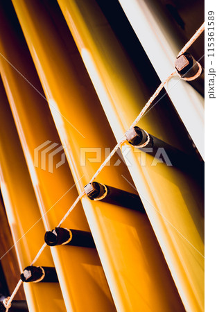 A variety of surfboards are neatly displayed on a stand 115361589