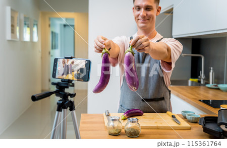 The chef is broadcasting live from workshop how to prepare a grilled eggplants with garlic The chef is broadcasting live from workshop how to prepare a grilled eggplants with garlic 115361764