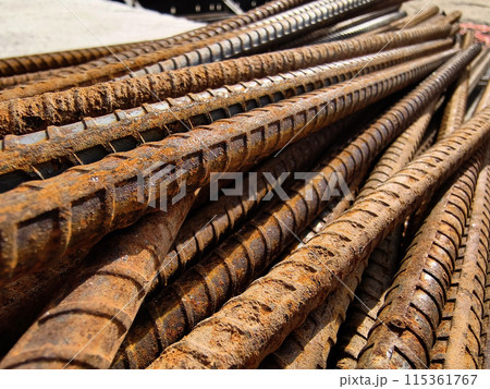 A rusty metal bars is stacked at the construction site 115361767