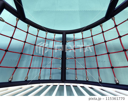 The trampoline features a mazepatterned surface for recreational use indoors 115361770