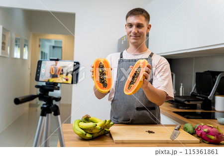 The chef is broadcasting live from workshop how to cuts and peels papaya The chef is broadcasting live from workshop how to cuts and peels papaya 115361861