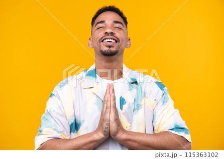 Emotional young black guy in casual raising fists up studio background, celebrating success, happy handsome african american millennial man sharing good emotions. Emotional young black guy in casual raising fists up studio background, celebrating success, happy handsome african american millennial man sharing good emotions. 115363102