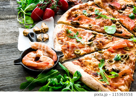tasty pizza on table tasty pizza on table 115363558