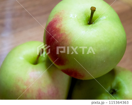 Natural Produce Showcase. Apples with a mix of colors, ideal for organic markets. Natural Produce Showcase. Apples with a mix of colors, ideal for organic markets. 115364363