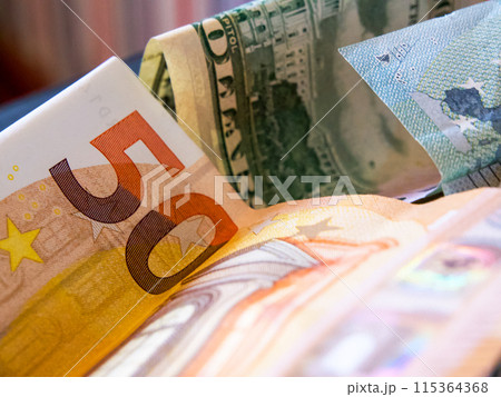 Currency Close-Up. Detailed view of a 50 note and $50 bill, highlighting textures and colors. 115364368