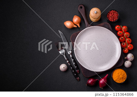 Empty ceramic round plate on dark textured concrete background Empty ceramic round plate on dark textured concrete background 115364866