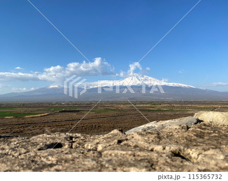 Ararat mount with a snow-capped peak in clear weather. Mountain picturesque landscape Ararat mount with a snow-capped peak in clear weather. Mountain picturesque landscape 115365732