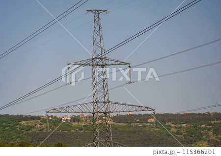 High voltage towers with sky background. Power line support with wires for electricity transmission. High voltage grid tower with wire cable at distribution station. Energy industry, energy saving 115366201
