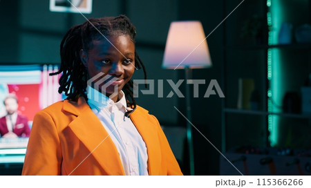 Portrait of university student participating in e learning courses, reviewing lesson materials and lecture notes at home office. Dedicated girl writing ideas for future exams or tests. Camera A. 115366266