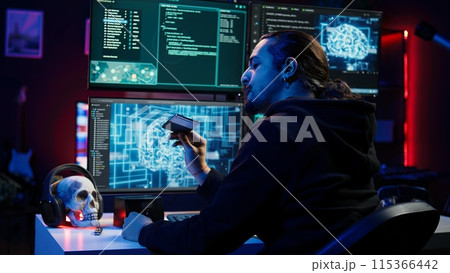 Hacker uploading sensitive data from SSD obtained from victim through ransomware virus, close up. Scammer inserting storage drive with stolen information from users, finishing evil plan, camera B 115366442