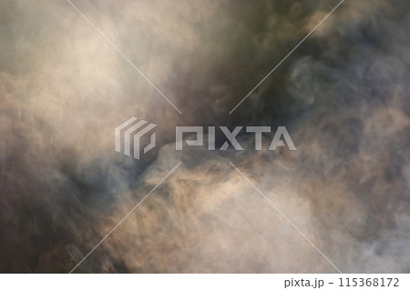 Hazy light and smoke make it look mysterious and enigmatic. 115368172