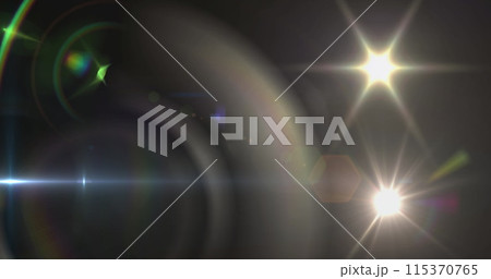 Image of spotlight with lens flare and light beam moving over dark background Image of spotlight with lens flare and light beam moving over dark background 115370765
