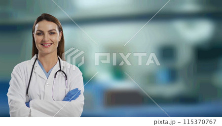 Portrait of caucasian female doctor with arms crossed smiling against hospital in background 115370767