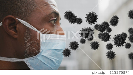 Image of covid 19 cells over african american man wearing face mask Image of covid 19 cells over african american man wearing face mask 115370874