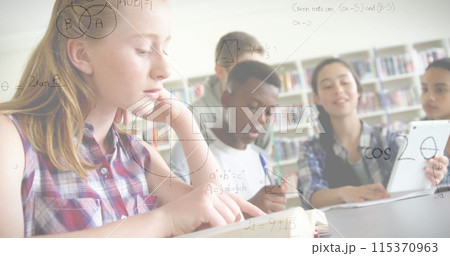 Image of mathematical formulas over students in classroom 115370963
