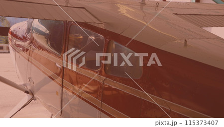 Close up view of an airplane parked at an airport 115373407