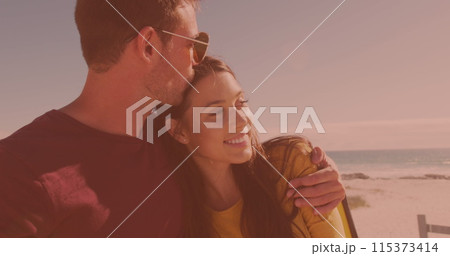 Happy caucasian young couple embracing each other at the beach 115373414