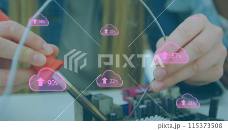 Image of digital cloud icons over two female students smiling and working together 115373508