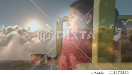 Image of clouds over caucasian woman in car 115373826