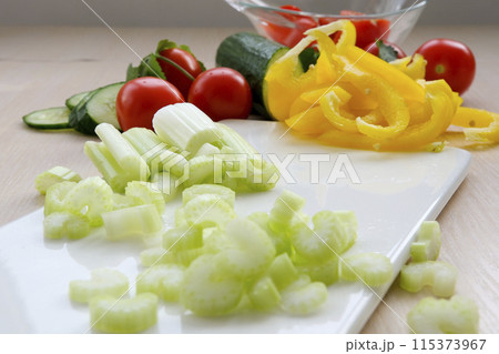 Sliced fresh celery or Celery stalk on cutting wooden board 115373967