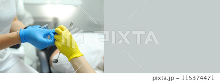 dental banner 2 people doctors assistant ad dental clinic address invitation help care mutual assistance support gray background he bright women's hands a mirror for examining teeth look around dental banner 2 people doctors assistant ad dental clinic address invitation help care mutual assistance support gray background he bright women's hands a mirror for examining teeth look around 115374471