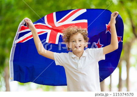 Child running with New Zealand flag. Kiwi fan Child running with New Zealand flag. Kiwi fan 115374570