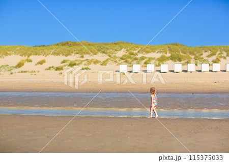 Kids playing on beach. Children play at sea. 115375033